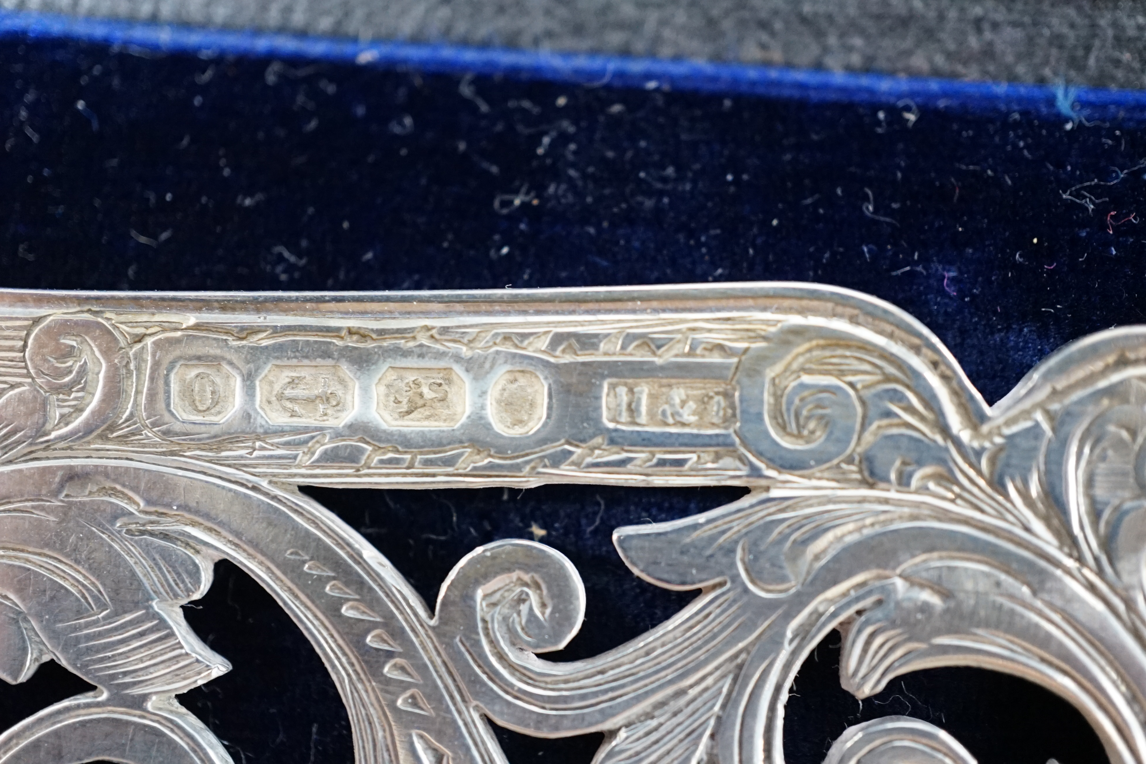 A cased pair of Victorian silver fish servers, maker H&I, Birmingham, 1863, knife 32.1cm. Condition - fair